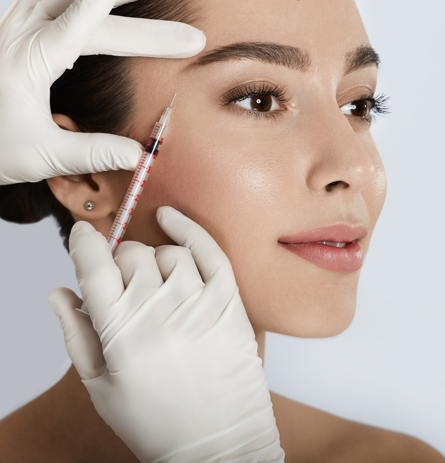 Beautiful woman receives anti wrinkle beauty injection for facial rejuvenation and wrinkle removal. Facial mesotherapy, eye wrinkle injection